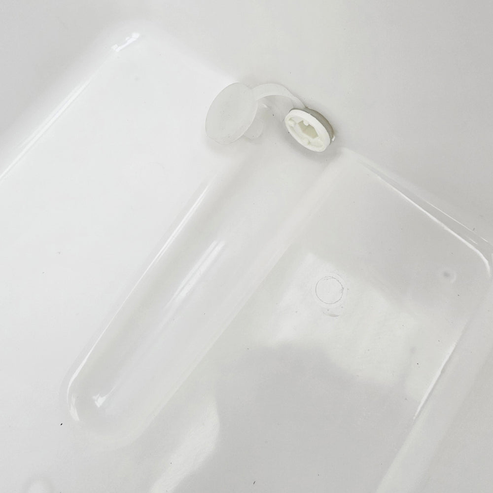 Silicone internal plug port. Make sure to remove this prior to filling if you want an easy access outer plug to undo.